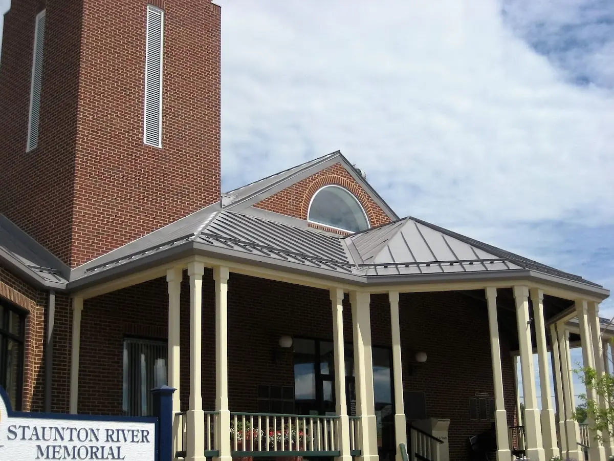 Skilled roofing craftsmen working on a residential roof in Harrietstown